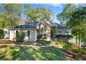 House exterior, stone accents and a large yard at 7149 Burnside Ct, Villa Rica, GA 30180