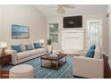 Spacious living room featuring a fireplace and plenty of natural light at 755 Holcombe Woods Ct, Auburn, GA 30011