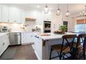 Modern kitchen with white cabinets, stainless steel appliances, and a large island at 4619 Spring St, Acworth, GA 30101