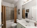 Bathroom with tub shower and grey tile at 2536 Skyland Ne Dr, Atlanta, GA 30319