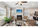 Cozy living room with fireplace and kitchen views at 2527 Swan Lake Dr, Grayson, GA 30017