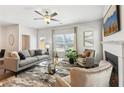 Bright living room with fireplace and large windows, featuring comfortable seating at 2527 Swan Lake Dr, Grayson, GA 30017