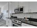 Kitchen boasts granite countertops and stainless steel appliances at 711 Cosmopolitan Ne Dr # 823, Atlanta, GA 30324