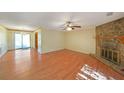 Living room with hardwood floors and stone fireplace at 3884 Wood Path Dr, Stone Mountain, GA 30083