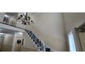 Elegant staircase with ornate railing in the building's entryway at 6851 Roswell Rd # O9, Atlanta, GA 30328