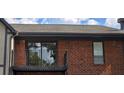 Brick building with balcony and sliding glass doors at 6851 Roswell Rd # O9, Atlanta, GA 30328