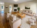 Virtually staged living room with fireplace and hardwood floors at 20 Pine Canyon Sw Dr # 24, Atlanta, GA 30331