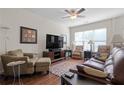 Spacious living room featuring hardwood floors, comfortable seating, and large windows at 1801 Liberty Nw Pkwy, Atlanta, GA 30318