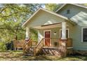 House exterior with wooden porch and steps at 2130 Perkerson Mill Rd, Austell, GA 30106