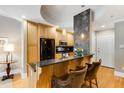 Open kitchen with breakfast bar, wood cabinets, and stainless steel appliances at 2255 Peachtree Rd # 328, Atlanta, GA 30309