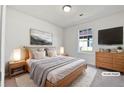 Virtually staged bedroom with a king-size bed and dresser at 5667 Chrys St, Powder Springs, GA 30127