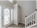 Bright entryway with stairs and closet at 1983 Smithfield Ave, Ellenwood, GA 30294