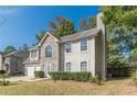 Two-story house with stone accents and two-car garage at 1983 Smithfield Ave, Ellenwood, GA 30294