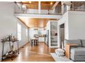 Open living room with high ceilings, loft, and hardwood floors at 1880 Vesta Ave, Atlanta, GA 30337