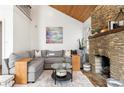Spacious living room featuring a stone fireplace and comfortable seating at 1880 Vesta Ave, Atlanta, GA 30337