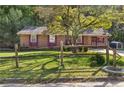 Brick ranch home with mature landscaping and a spacious yard at 37 Crystal River Dr, Riverdale, GA 30274