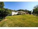 Ranch house with white brick exterior and large yard at 2620 Old Covington Ne Rd, Conyers, GA 30013