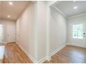Light and airy entryway with hardwood floors at 7530 Homer Dr, Cumming, GA 30028