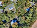 Aerial view of a wooded lot with a small building at 3534 Dahlonega Hwy, Cumming, GA 30028