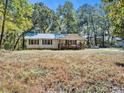 Simple white house exterior with a small front porch at 3534 Dahlonega Hwy, Cumming, GA 30028