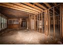 Unfinished interior with exposed beams and walls at 418 N Highland Ne Ave, Atlanta, GA 30307