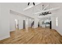 Spacious living area with hardwood floors, high ceilings, exposed beams, and an open floor plan at 865 Mcdaniel Sw St, Atlanta, GA 30310