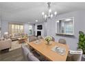 Virtually staged dining and living room with hardwood floors at 1002 Cumberland Se Ct, Smyrna, GA 30080
