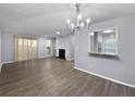 Virtually staged living room with hardwood floors at 1002 Cumberland Se Ct, Smyrna, GA 30080