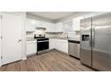 Kitchen with stainless steel appliances and granite countertops at 2523 Mistletoe Ln, Snellville, GA 30039