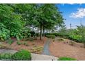 Landscaped community courtyard with walking path and benches at 3637 Habersham Nw Rd # 46, Atlanta, GA 30305