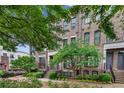 Three story brick townhouses with front yard landscaping at 3637 Habersham Nw Rd # 46, Atlanta, GA 30305