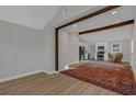 Open living room features a large area rug and view into the kitchen at 369 Bell Se St, Marietta, GA 30060