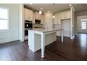 Island kitchen with stainless steel appliances and hardwood floors at 3864 Kastler Dr, South Fulton, GA 30349