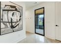 Bright entryway with concrete floors and large art piece at 10 Moreland Ne Ave, Atlanta, GA 30307