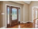 Elegant entryway with hardwood floors and a beautiful wood door at 1201 Keencheefoonee Rd, Rutledge, GA 30663
