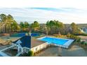 Community pool, tennis courts, and clubhouse at 1898 Lacebark Elm Way, Lawrenceville, GA 30045