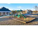 Community playground with slides and play structures at 1898 Lacebark Elm Way, Lawrenceville, GA 30045