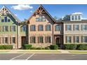 Attractive townhouses with stone accents and brown shutters at 294 Trecastle Sq, Canton, GA 30114