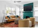 Cozy living room features a fireplace, large TV, and comfortable seating at 1696 Emerald Sw Ave, Atlanta, GA 30310