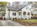 White brick home with a covered porch and landscaping at 1696 Emerald Sw Ave, Atlanta, GA 30310