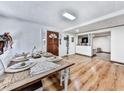 Rustic farmhouse dining table in a bright dining area with hardwood floors at 198 Oak Hill Cir, Canton, GA 30114