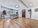 Bright dining room featuring a rustic wooden table and hardwood floors at 198 Oak Hill Cir, Canton, GA 30114