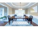 Formal dining room with hardwood floors and a chandelier at 1896 Alcovy Bluff Way, Lawrenceville, GA 30045