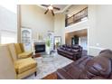 Two-story living room with hardwood floors, fireplace and plenty of natural light at 1896 Alcovy Bluff Way, Lawrenceville, GA 30045
