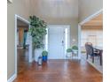 Bright and spacious entryway with hardwood floors and decorative plants at 1896 Alcovy Bluff Way, Lawrenceville, GA 30045