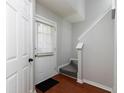 Bright entryway with hardwood floors, white door and staircase at 253 Gallant Se # 17, Mableton, GA 30126