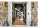 Elegant entryway with double doors, hardwood floors, and a water feature at 4478 Thurgood Estates Dr, Ellenwood, GA 30294