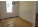 Simple dining room with hardwood floors and a window at 6348 Wellington Walk Way, Lithonia, GA 30058