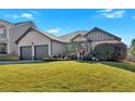 Two-story house with two-car garage and beautiful landscaping at 911 Mcduffie Cir, Douglasville, GA 30134