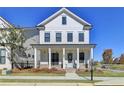 Two-story white house with a front porch at 4627 Molder Dr, Buford, GA 30518